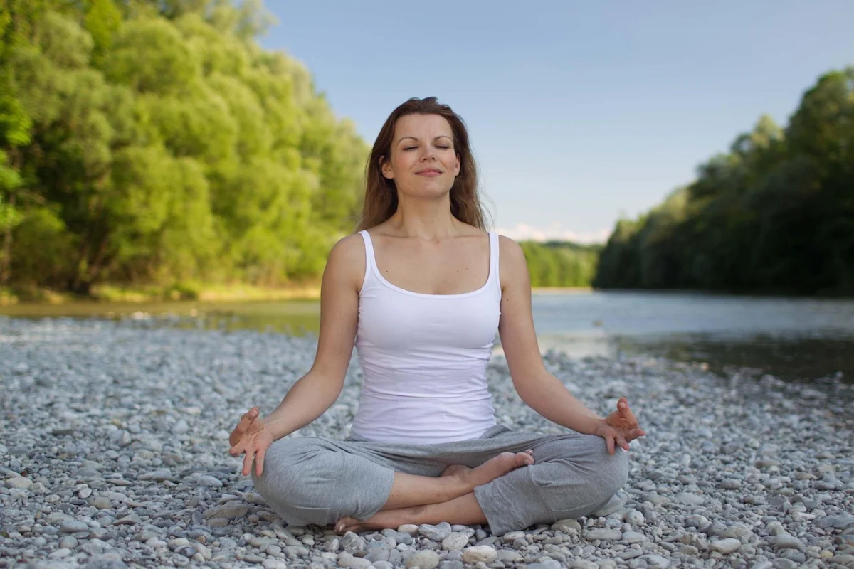 woman-5380651_1280 Person meditating on the beach